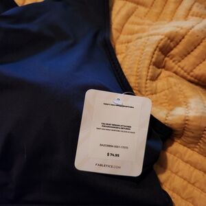 2 Fabletics black sports bras. NWT. Size 2X and 1X.